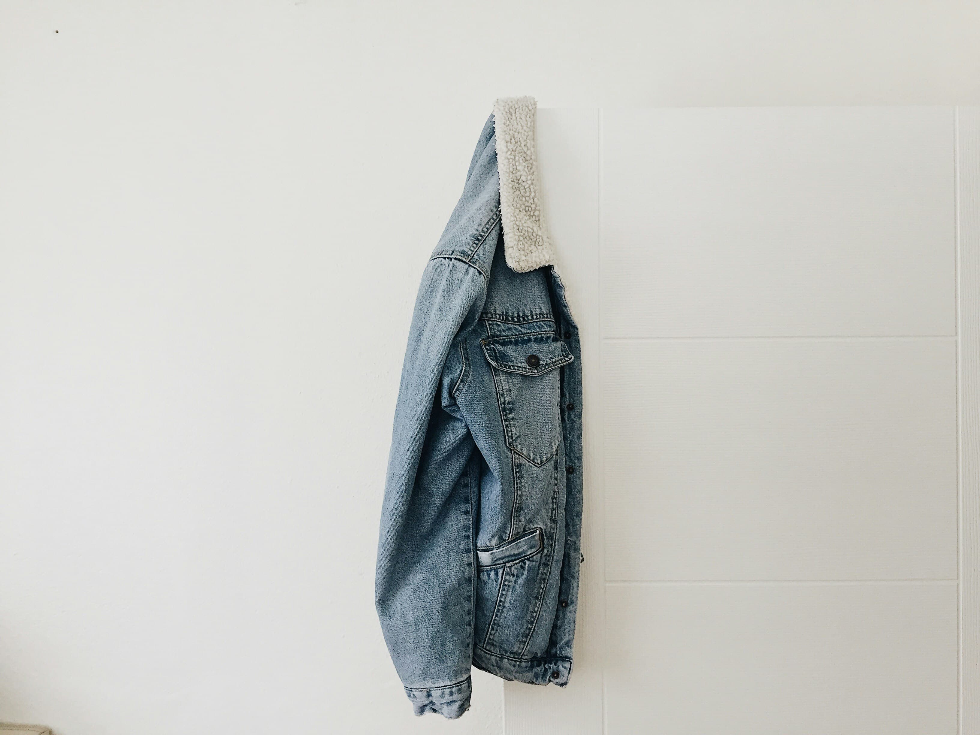 Retro denim jacket with distressed details, metal buttons, and fur collar