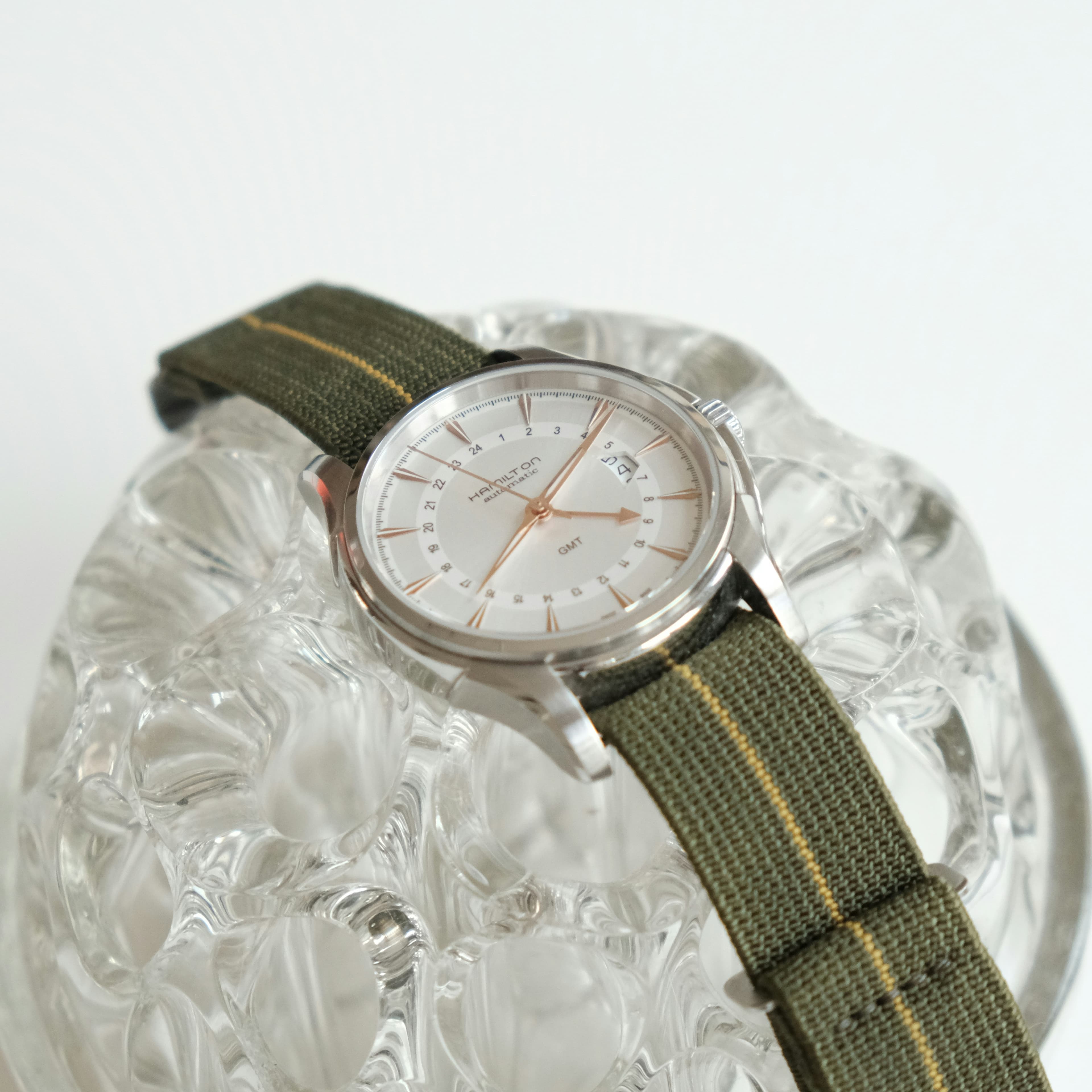 Luxury gold-tone analog watch with leather strap and chronograph features